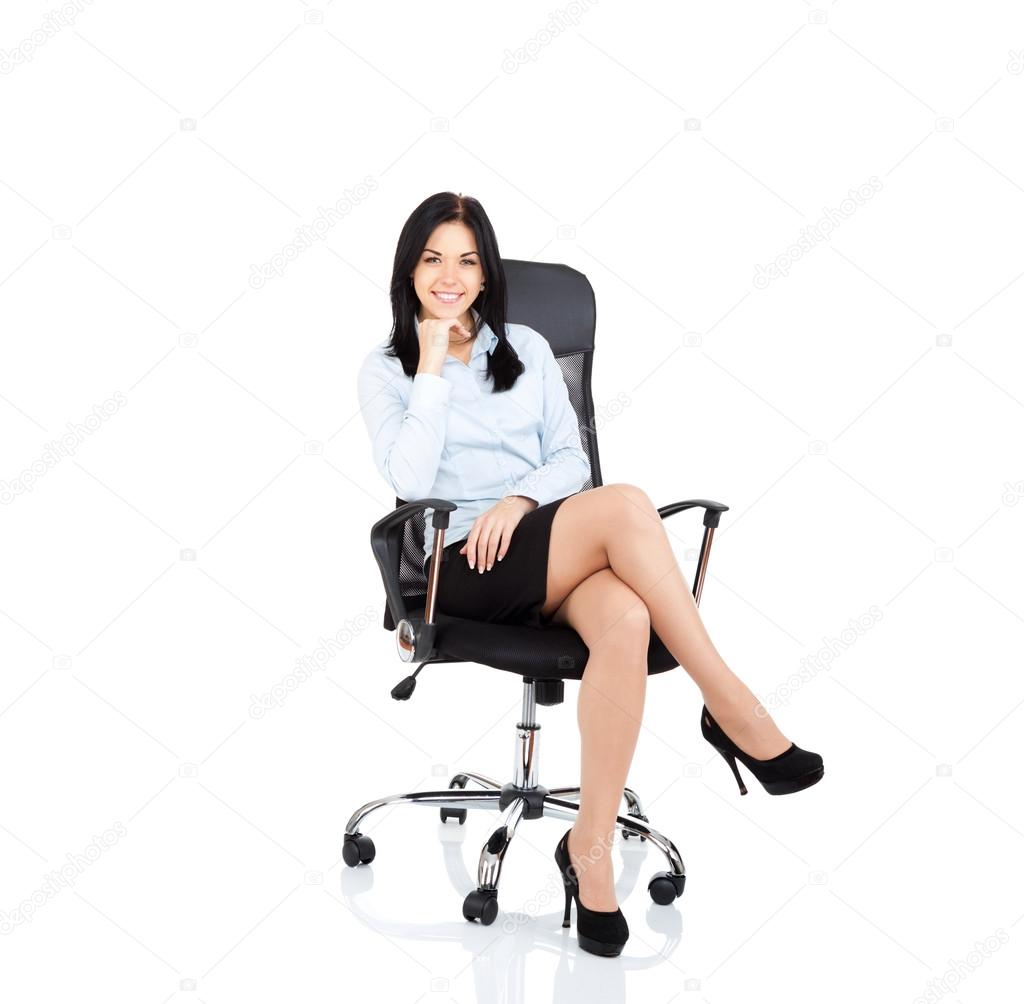 Smiling business woman sitting in chair