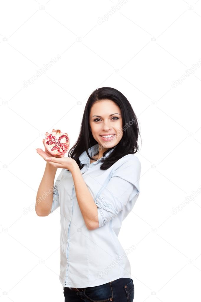 Young woman hold pomegranate