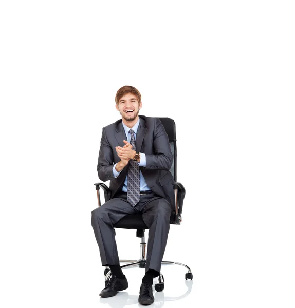 Businessman applauding hands sitting in chair — Stock Photo, Image