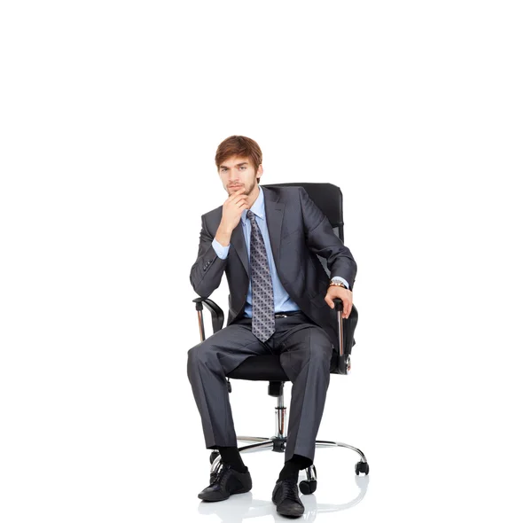 Podnikatel, sedí v křesle — Stock fotografie