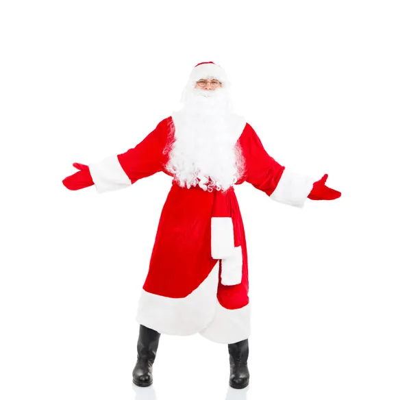 Санта-Клаус держит широко открытый жест приветствия пальмы — стоковое фото