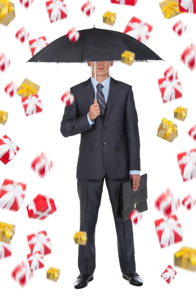 Homem de negócios segurar um guarda-chuva — Fotografia de Stock