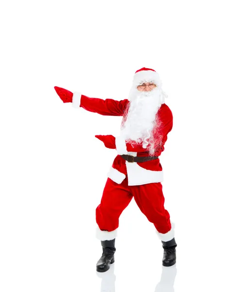Santa claus trzymając transparent punkt palcem rękawicy puste — Zdjęcie stockowe