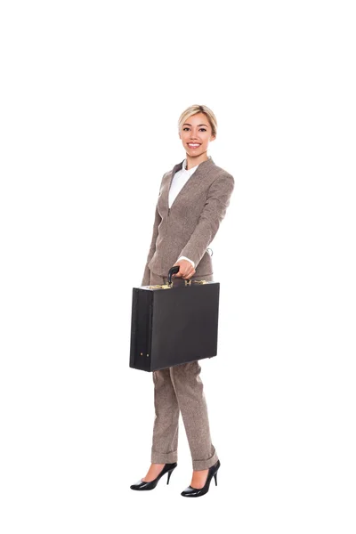 Business woman smilling and passing forward black briefcase — Stock Photo, Image