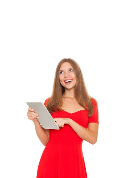 Pretty woman with happy smile think looking up to empty copy space and holding tablet computer — Stock Photo, Image