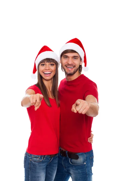 Natal feriado casal apontar dedo para você — Fotografia de Stock