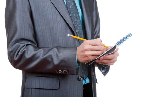 Hombre de negocios escribiendo en cuaderno — Foto de Stock
