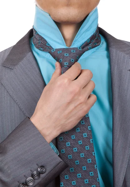 Businessman straightens tie — Stock Photo, Image