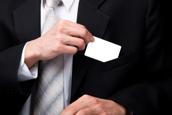 Business man holding card — Stock Photo, Image
