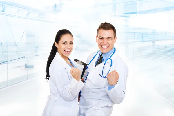 Happy man and woman doctors — Stock Photo, Image