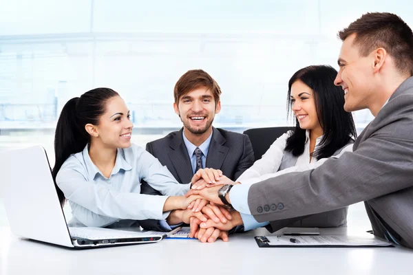 Business people holding pile of hands — Stock Photo, Image