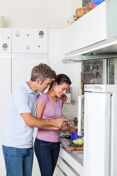 Lovely couple cooking vegetable — Stock Photo, Image