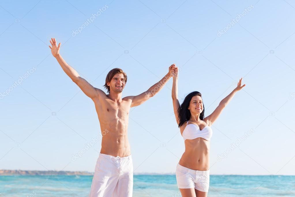 Couple with raised arms