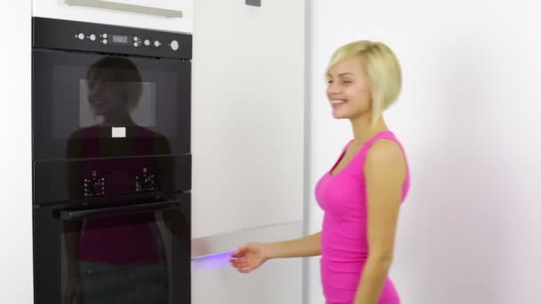 Woman open refrigerator and drink milk — Stock Video