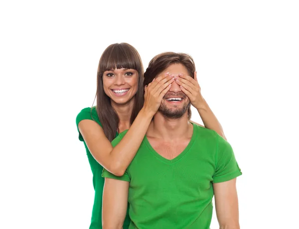Woman covering man's eyes — Stock Photo, Image