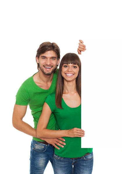 Couple with blank board — Stock Photo, Image