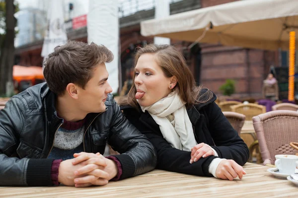 Woman Teasing Man While Sitting At Outdoor Restaurant — Stock Photo, Image