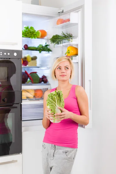 Woman holding green cabbage — Stock Photo, Image