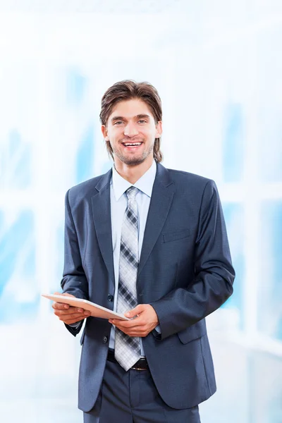 Business man holds tablet pad Stock Picture