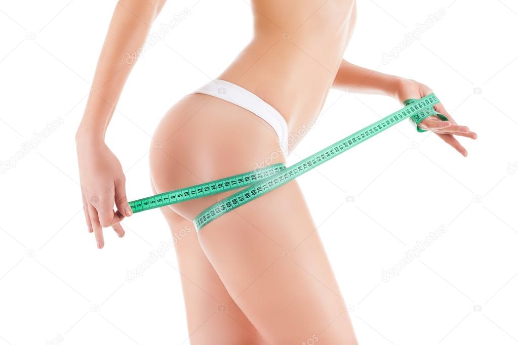 Woman measuring leg hip