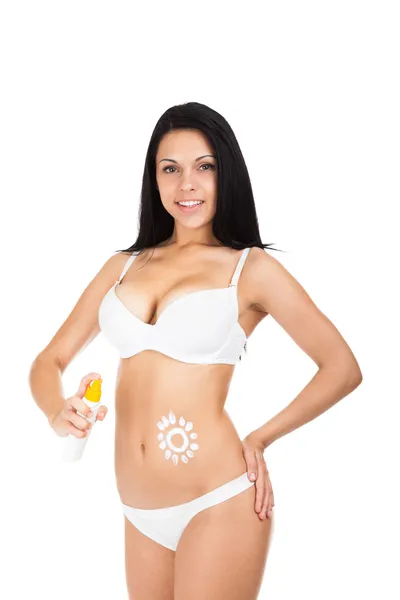 Loción protector solar sobre vientre de mujer bronceada —  Fotos de Stock