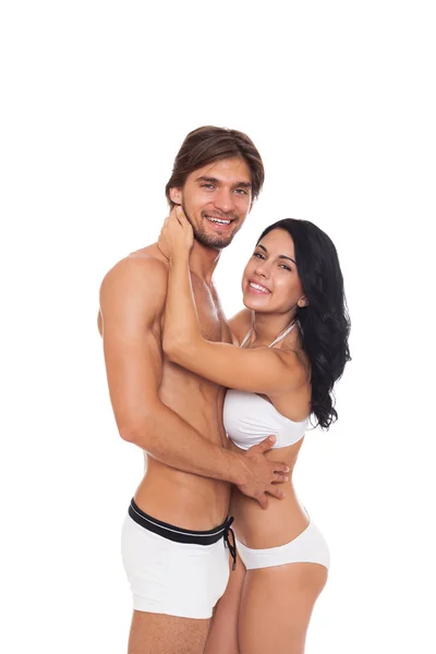 Couple souriant en maillot de bain embrassant — Photo