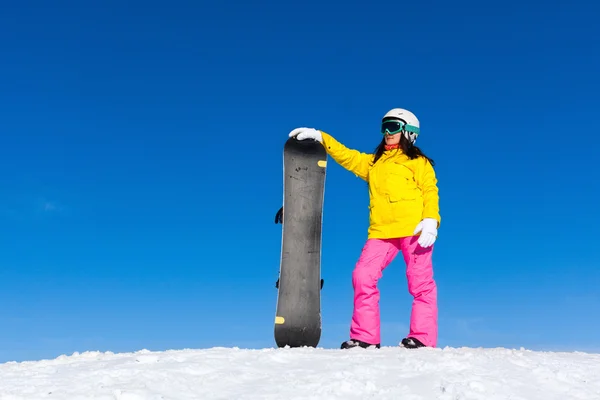 Snowboarder standing hold snowboard — Stock Photo, Image