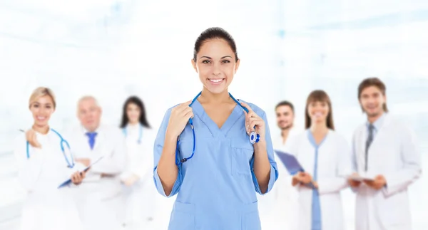 Doctor woman with team — Stock Photo, Image