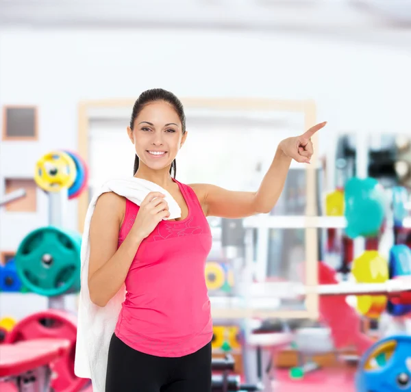 Fitness woman pointing — Stock Photo, Image