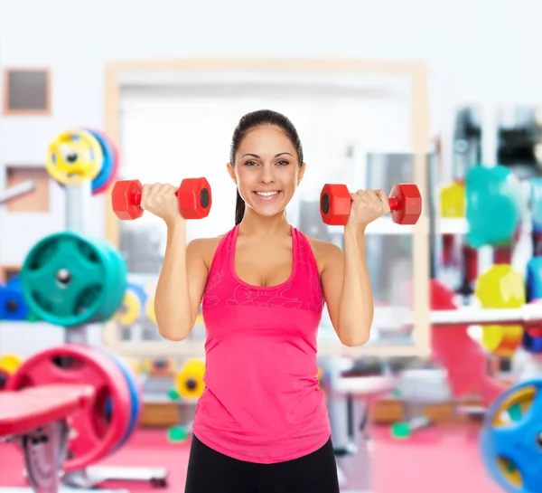 Girl doing exercises with dumbbells — Stock Photo, Image