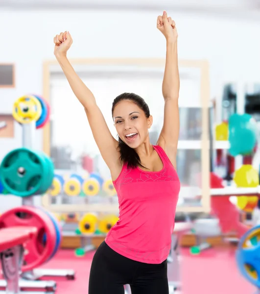 Fitness woman puts hand up — Stock Photo, Image