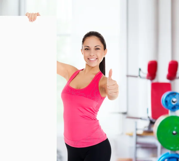 Esporte mulher fitness com placa em branco — Fotografia de Stock