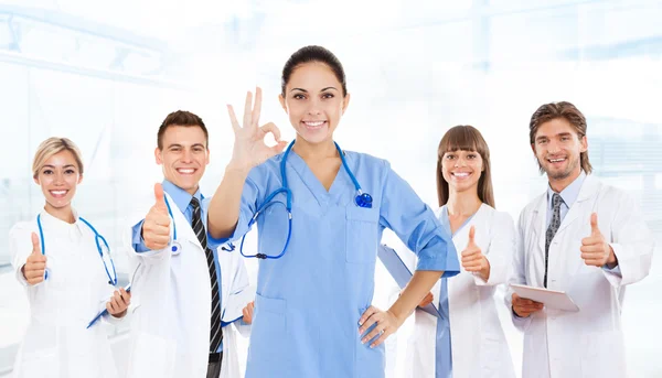 Female surgeon doctor with team — Stock Photo, Image