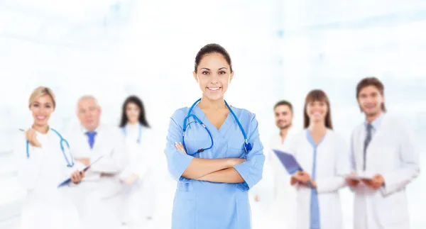 Female surgeon doctor with team — Stock Photo, Image