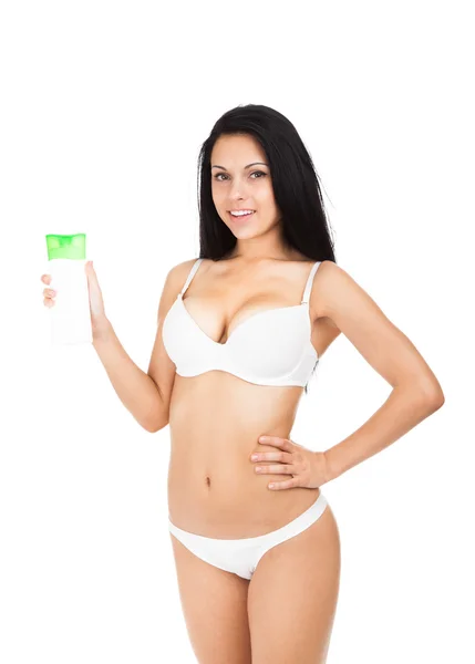 Woman holding cosmetics lotion — Stock Photo, Image