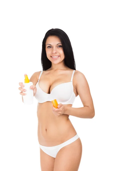 Woman holding cosmetics lotion — Stock Photo, Image