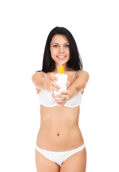 Woman holding cosmetics lotion — Stock Photo, Image