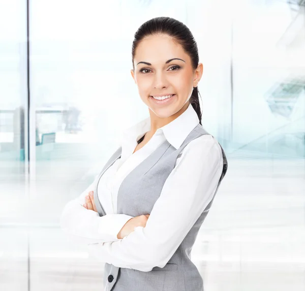 Businesswoman smiles, folded hands — Stock Photo, Image