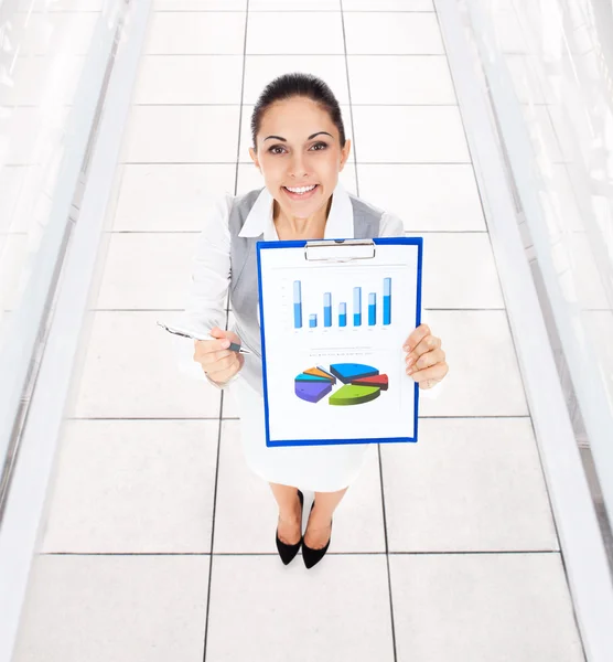 Smiling businesswoman hold clipboard — Stock Photo, Image