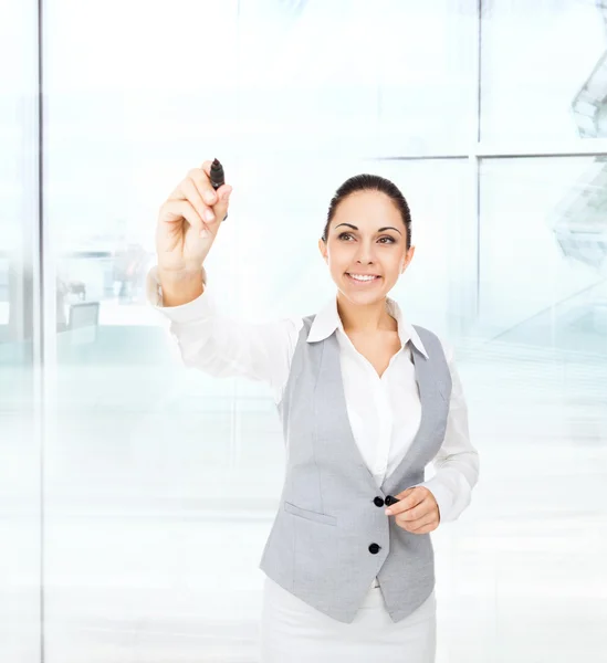 Business woman draws with pen — Stock Photo, Image