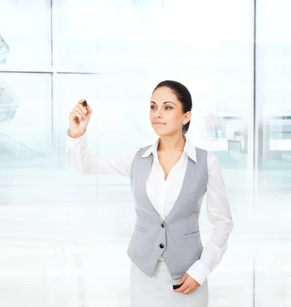 Businesswoman draws with pen — Stock Photo, Image