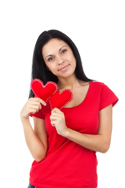 Attractive girl holding two hearts — Stock Photo, Image