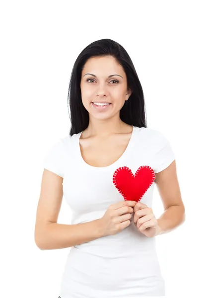 Attractive brunette girl holding heart — Stock Photo, Image