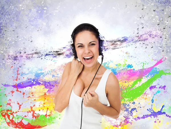 Woman in headphones listening to music — Stock Photo, Image