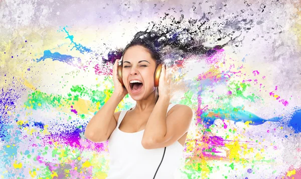 Woman in headphones listening to music — Stock Photo, Image