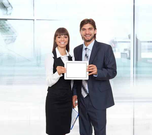 Business couple showing tablet pc — Stock Photo, Image