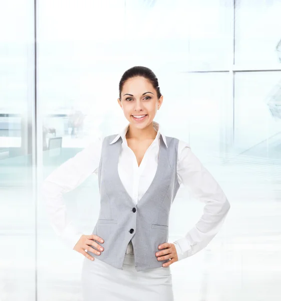 Smiling businesswoman  in modern office Royalty Free Stock Images