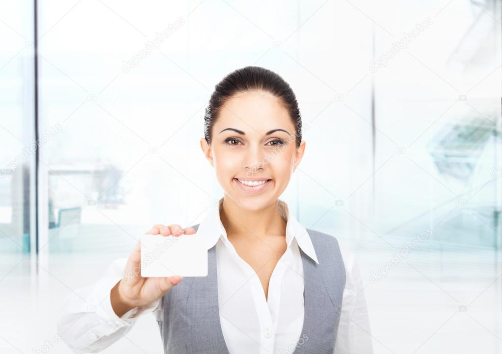 Businesswoman holds blank business card