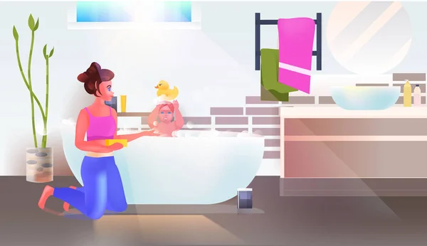 Young woman washing little daughter in bath bathroom interior horizontal full length — Stock Vector