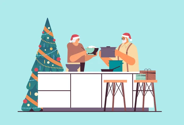Ηλικιωμένο ζευγάρι σε καπέλα santa μαγείρεμα μαζί στην κουζίνα Χριστουγεννιάτικο δείπνο προετοιμασία Πρωτοχρονιά γιορτές — Διανυσματικό Αρχείο